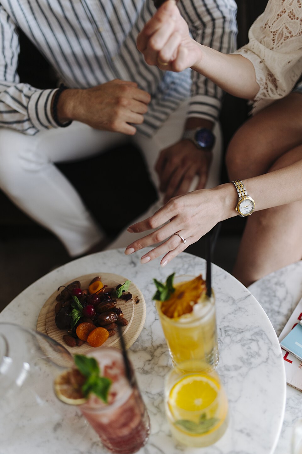 Two people talking together over food
