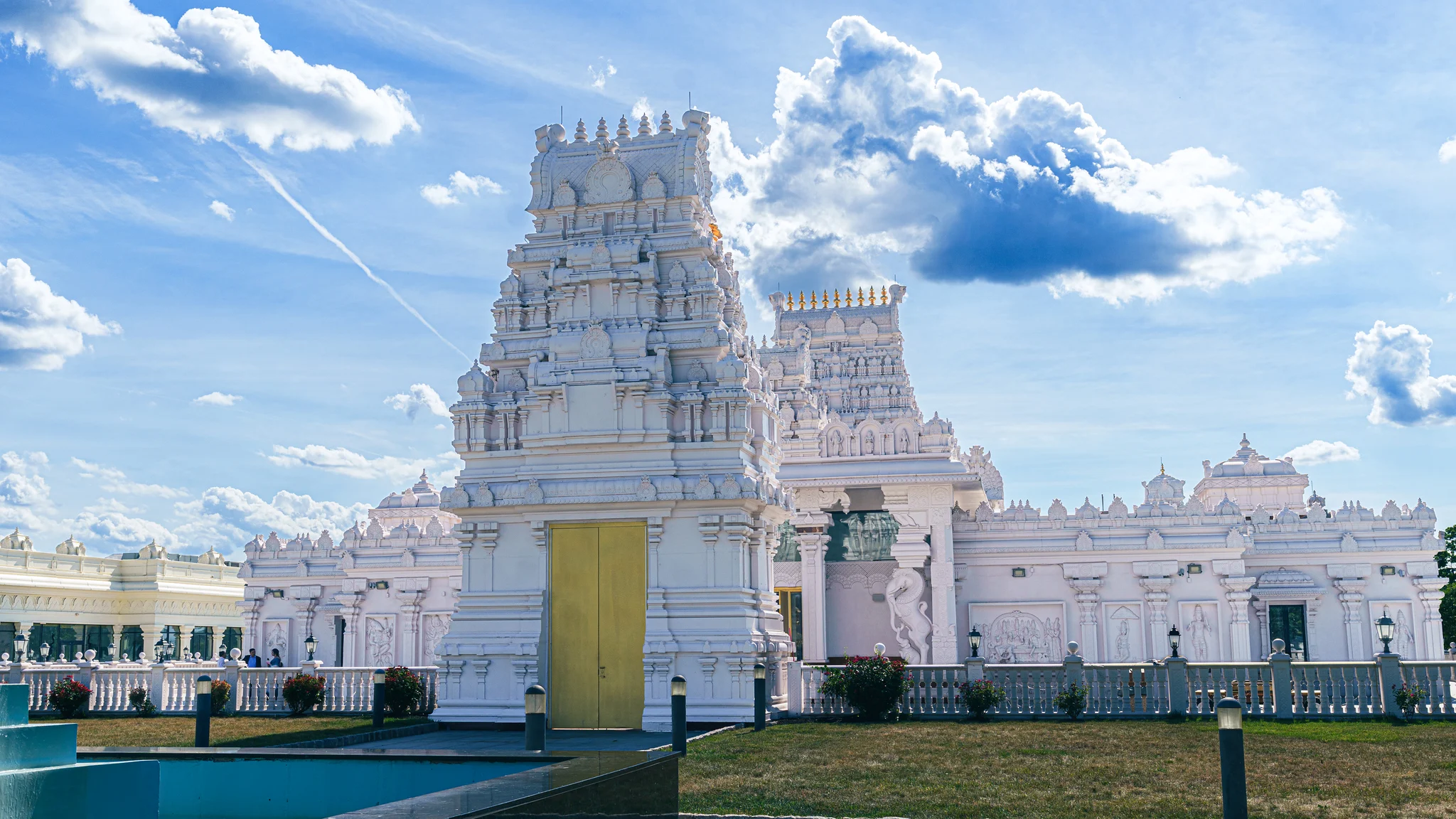 Ornate white entrance towers of Sri Venkateswara Temple